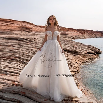 2023 חוף השנהב מחוץ כתף תחרה מסיבת חתונה שמלות חזרה עם רוכסן תוצרת אישית היעד עמוק V-צוואר קו שמלת הכלה